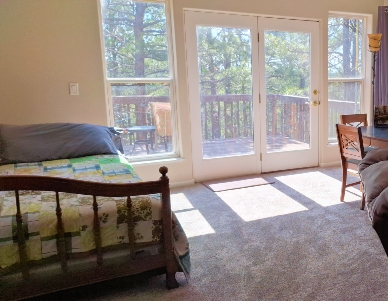 Upper Family Room & Trendle Beds at Boxelder Bluff Spacious upper family room with twin trundle beds and Black Hills forest views at Boxelder Bluff