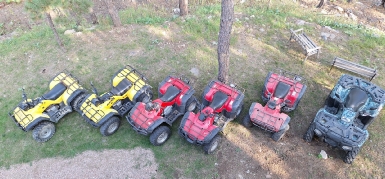 ATVs parked at Boxelder Bluff, a Black Hills vacation base near area trails